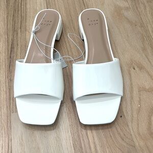 White patent slide sandals